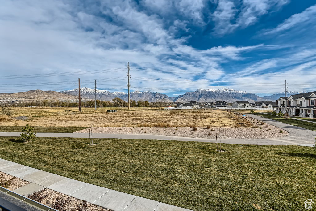 View of green lawn with a mountain view