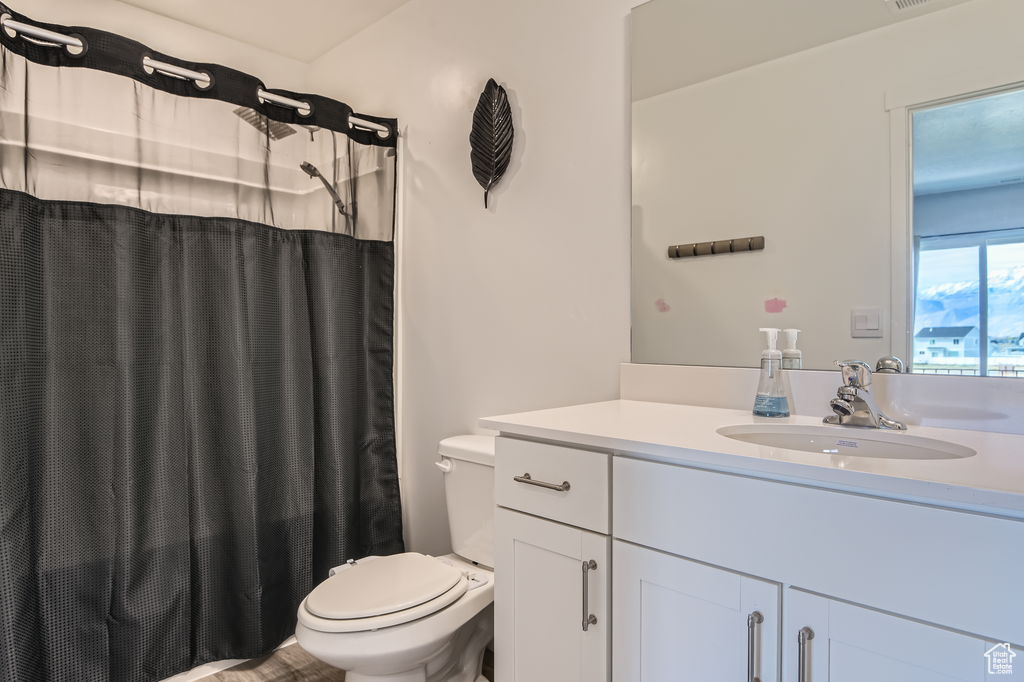 Bathroom featuring vanity and a shower with curtain