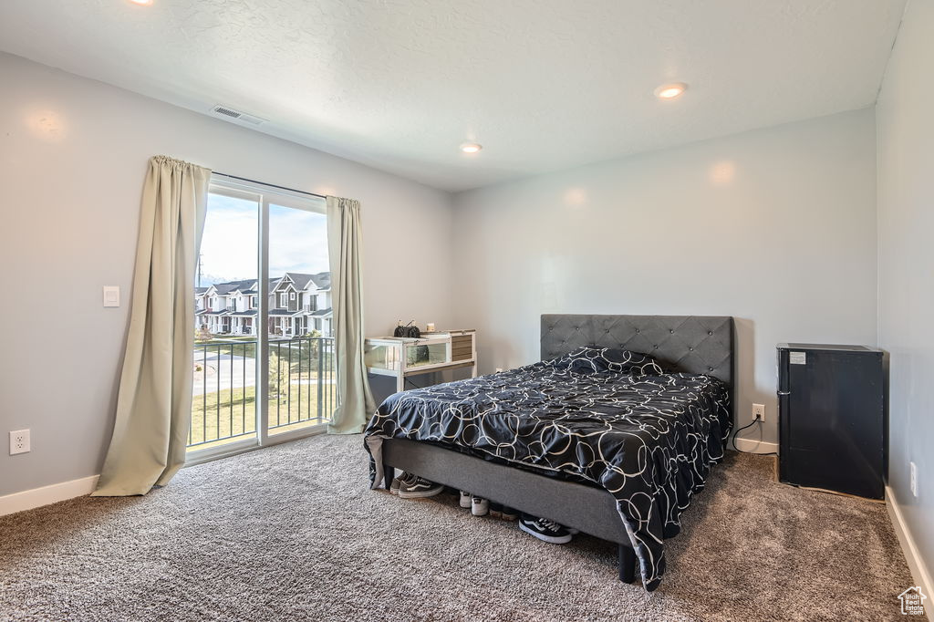 Carpeted bedroom featuring access to outside and recessed lighting