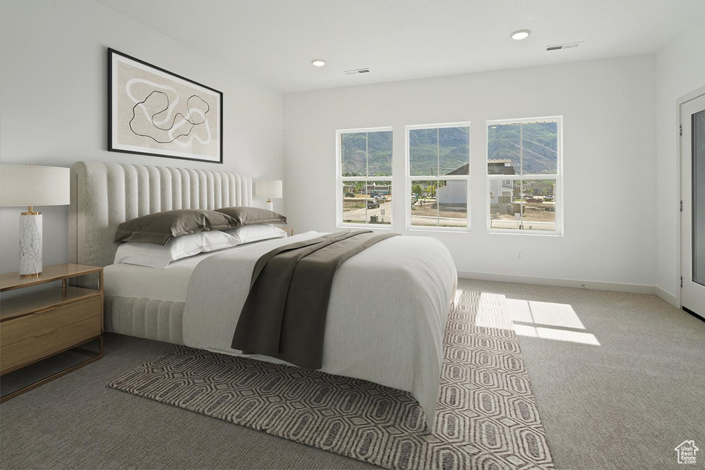 Carpeted bedroom with recessed lighting and baseboards