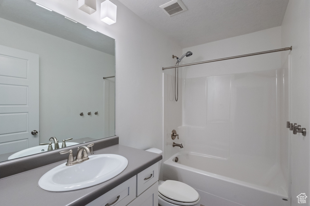 Full bathroom featuring vanity and bathing tub / shower combination