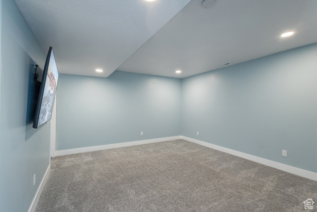Empty room featuring carpet and recessed lighting