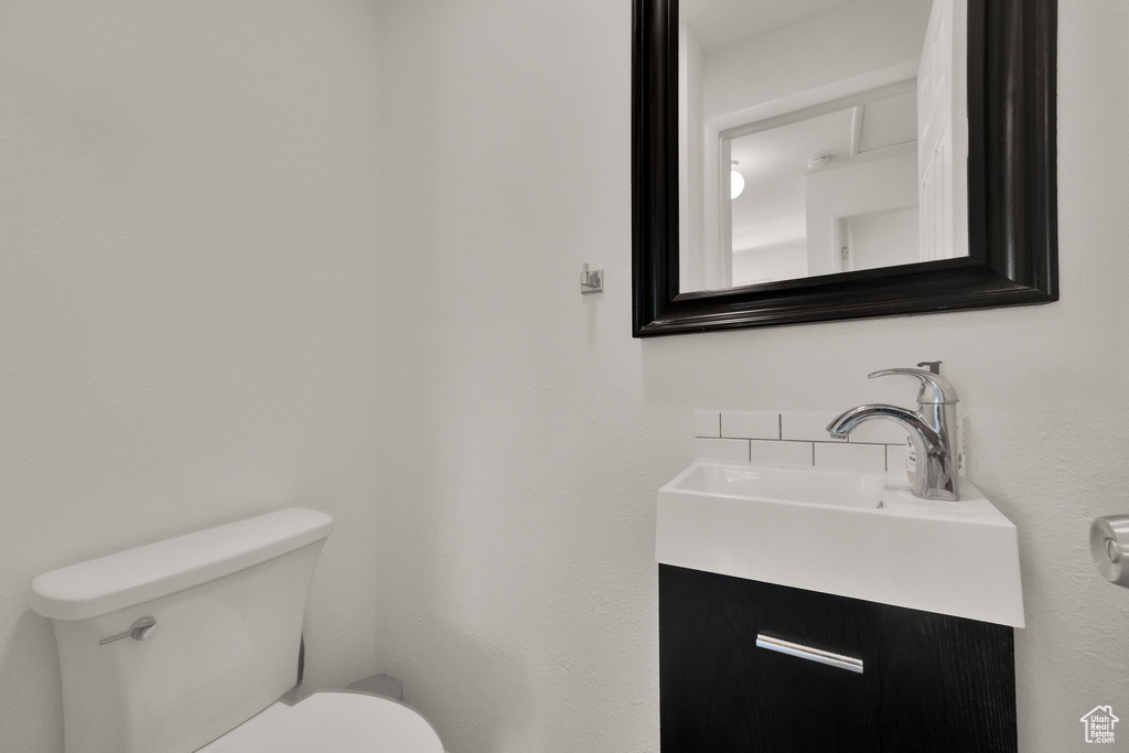 Bathroom featuring toilet and vanity