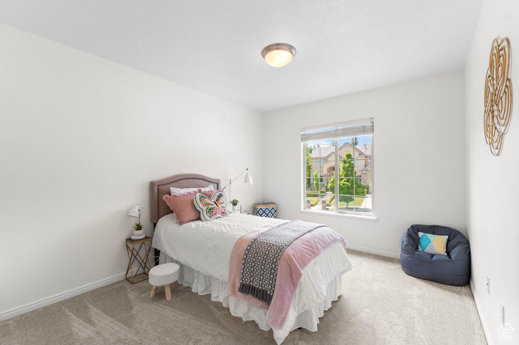 Carpeted bedroom with baseboards