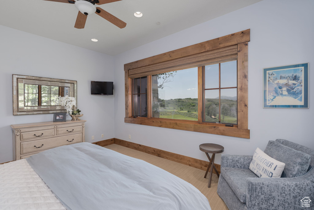 Bedroom featuring recessed lighting, ceiling fan, and light carpet