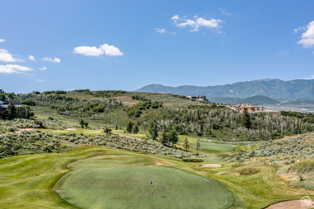 Surrounding community with a mountain view and view of golf course