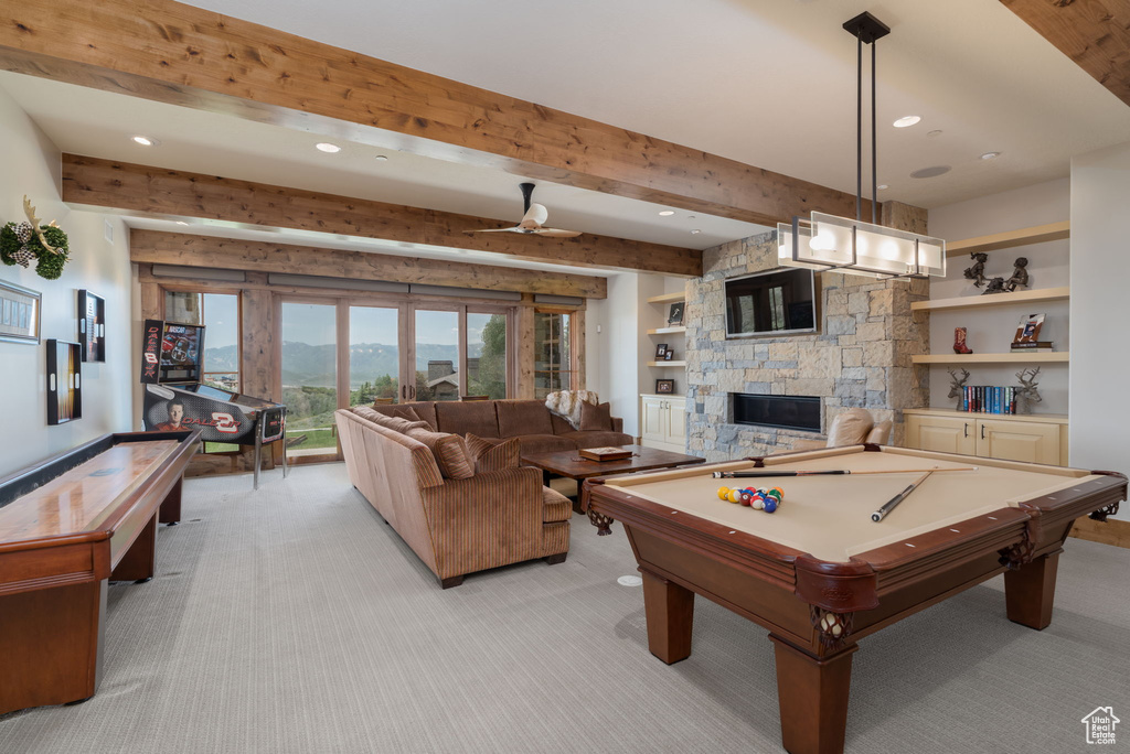 Playroom featuring light carpet, a fireplace, recessed lighting, beamed ceiling, and billiards