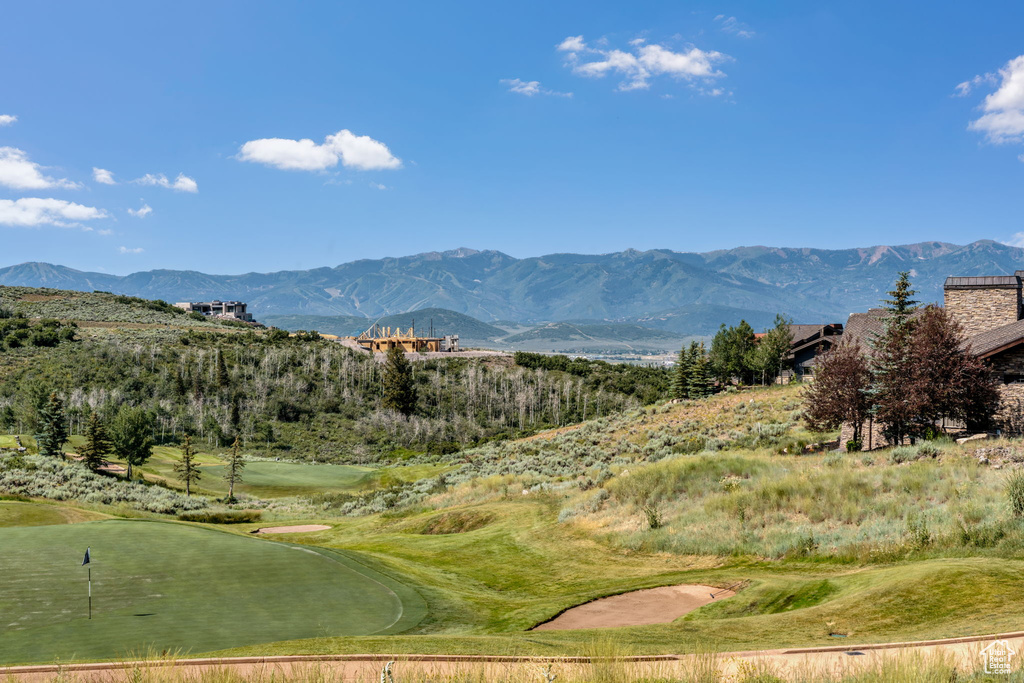 View of mountain background featuring a local golf course