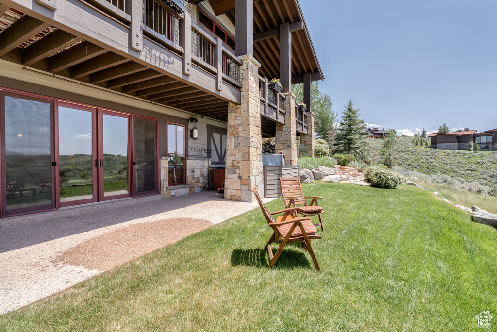 View of green lawn with a balcony
