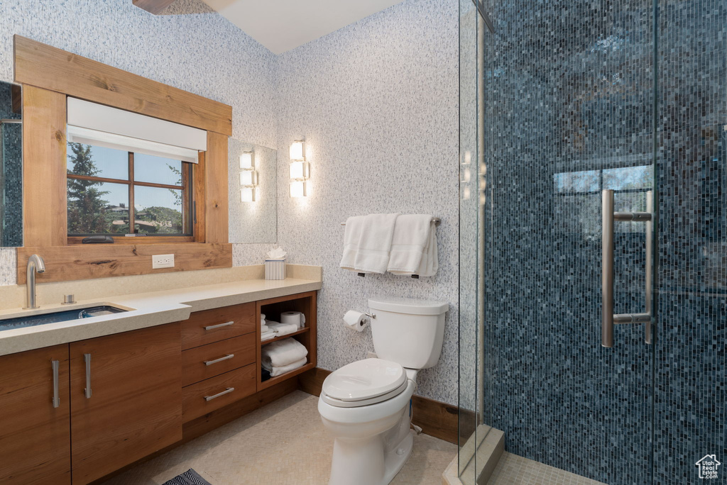 Full bath featuring vanity and a shower stall