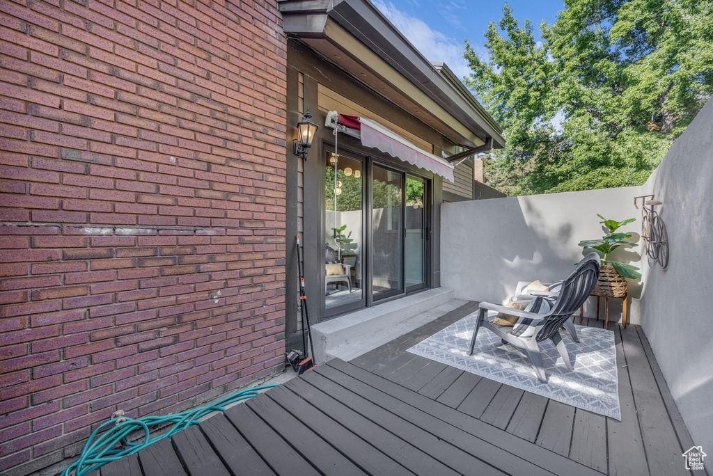Wooden terrace featuring a fenced backyard
