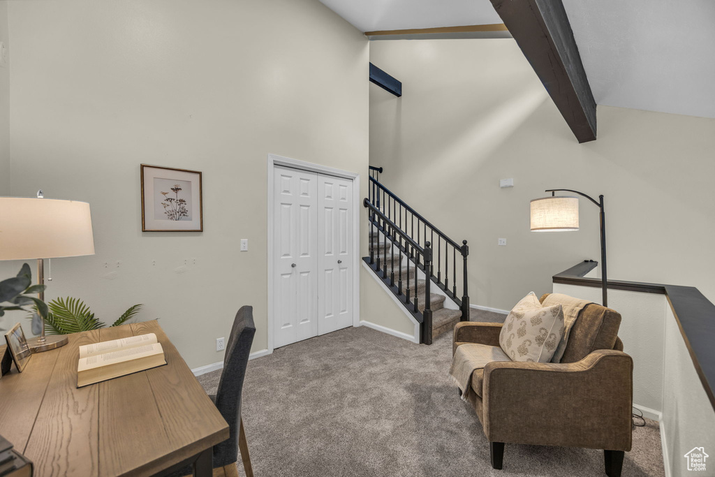 Carpeted office space with baseboards