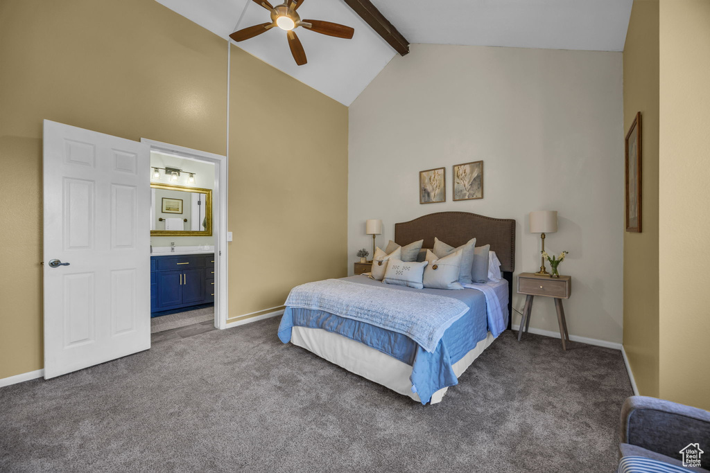 Carpeted bedroom with beam ceiling, high vaulted ceiling, ensuite bath, a ceiling fan, and a bar