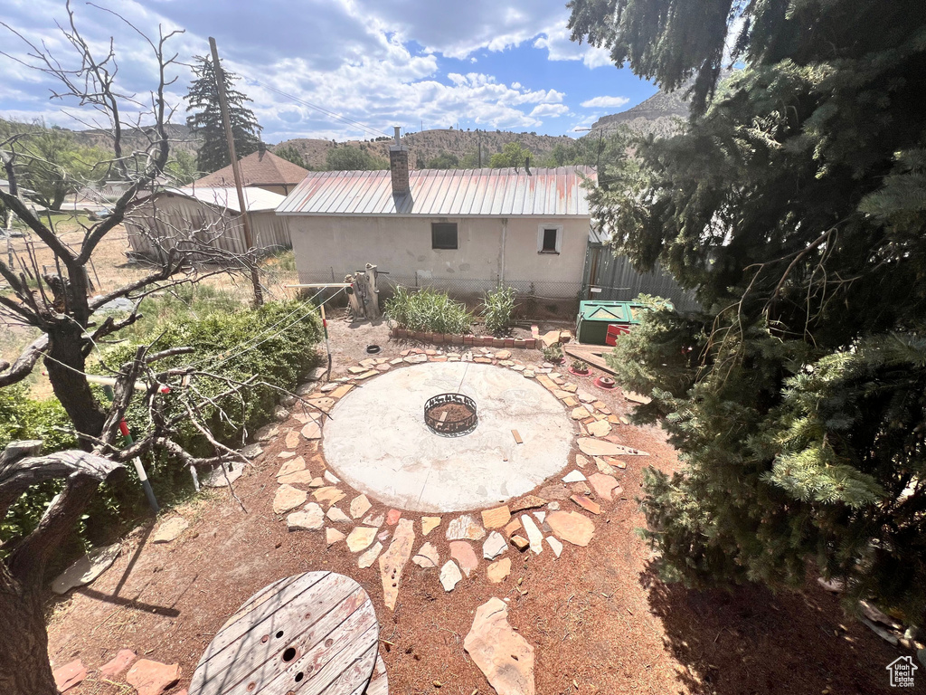 View of patio / terrace with an outdoor fire pit