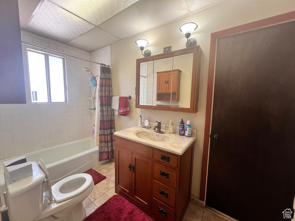 Full bathroom featuring vanity, tile patterned flooring, and shower / tub combo