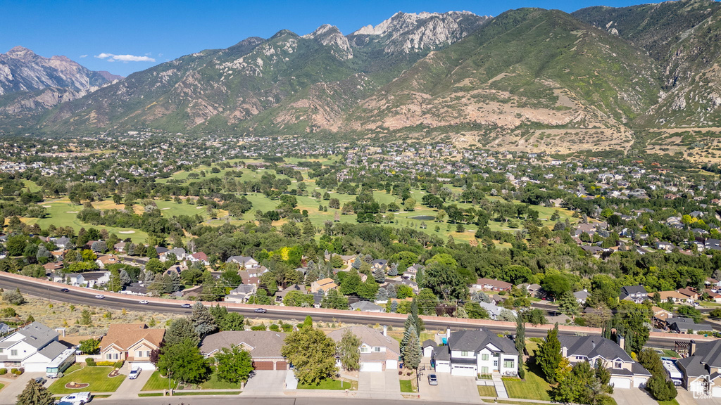 Aerial view of residential area featuring mountains