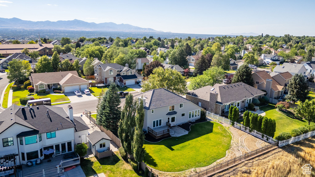 Aerial perspective of suburban area featuring a mountain backdrop