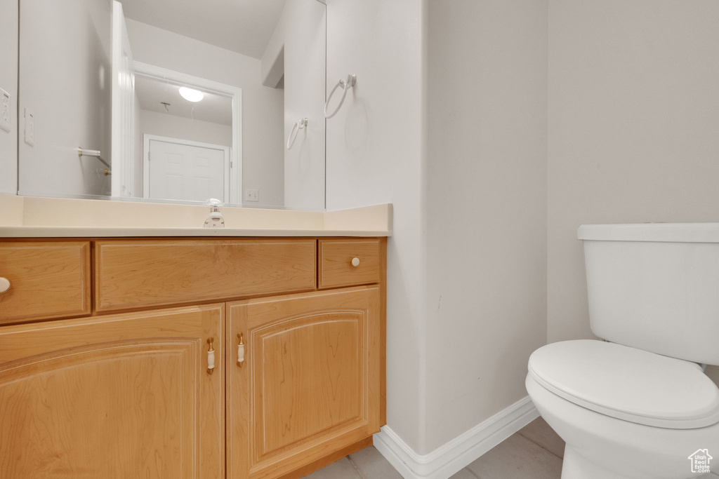 Bathroom with vanity and tile patterned flooring