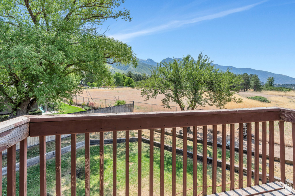 Wooden deck featuring a mountain view