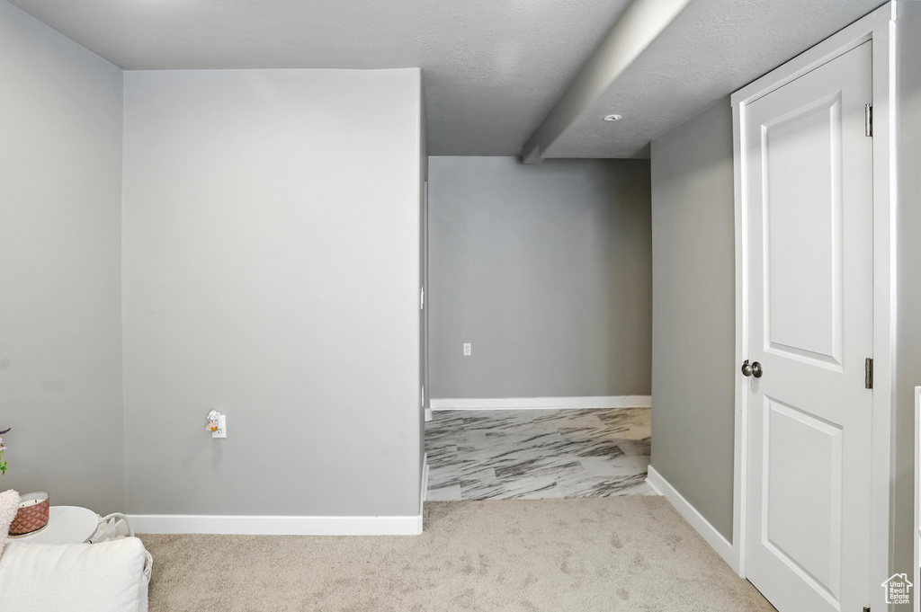 Sitting room with baseboards and carpet floors