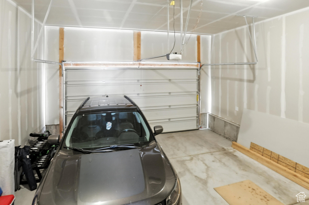Garage featuring a garage door opener