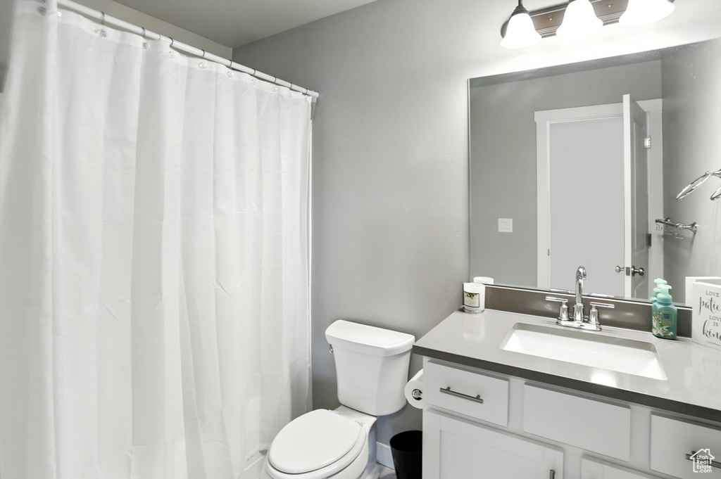 Full bath featuring vanity and a shower with curtain