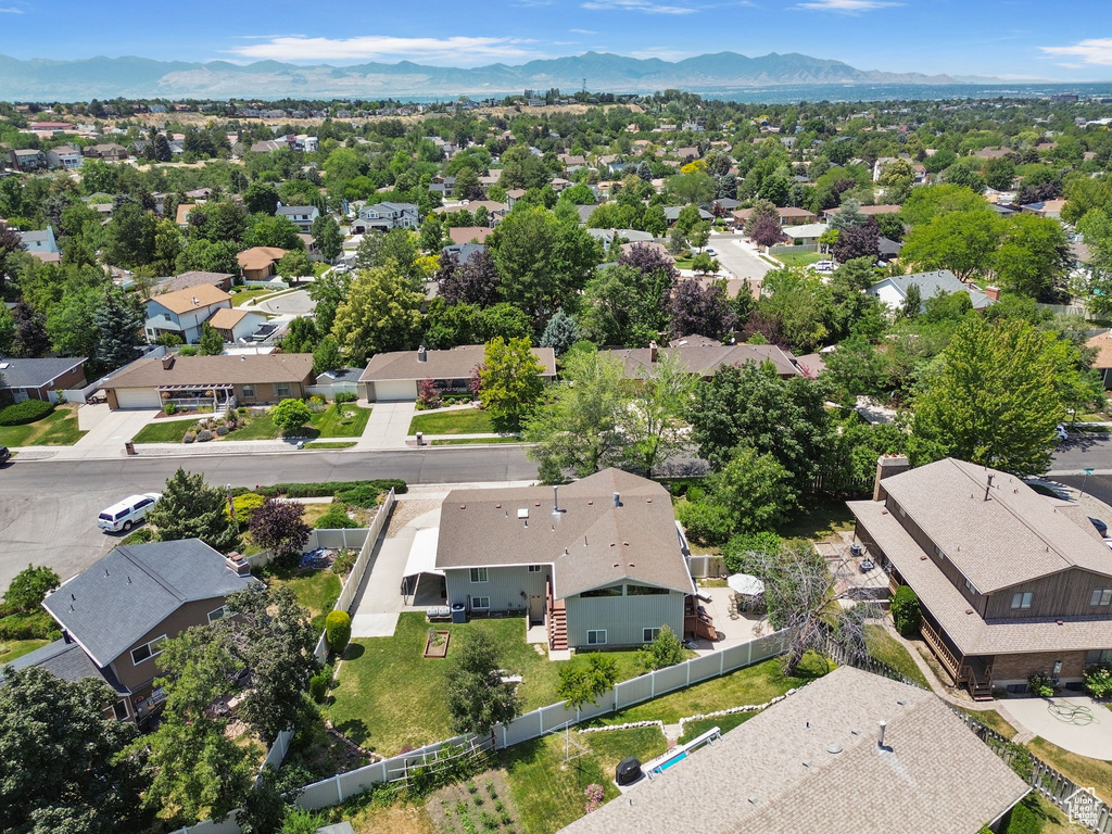Aerial view of residential area with a mountainous background