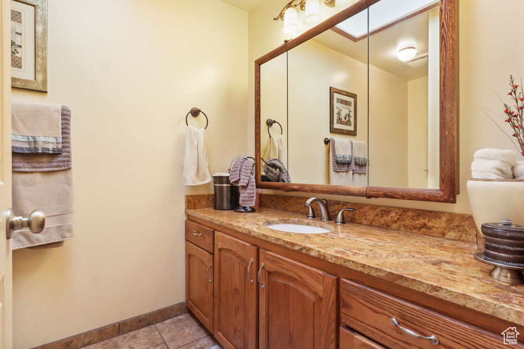 Bathroom with vanity and tile patterned floors