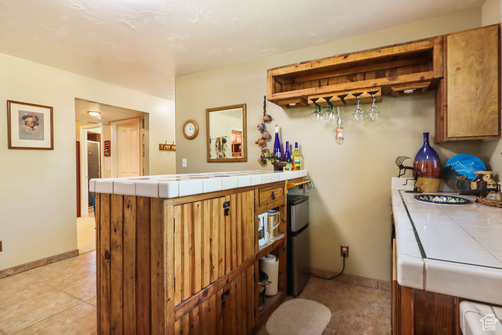 Indoor dry bar featuring baseboards