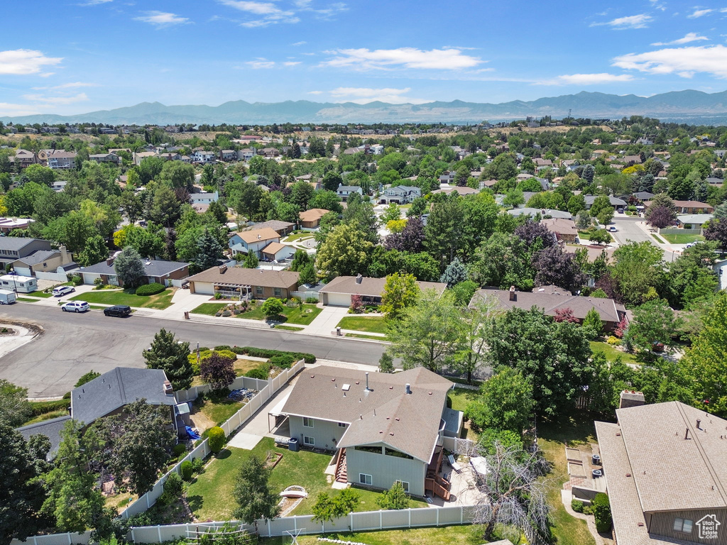 Aerial perspective of suburban area with a mountainous background