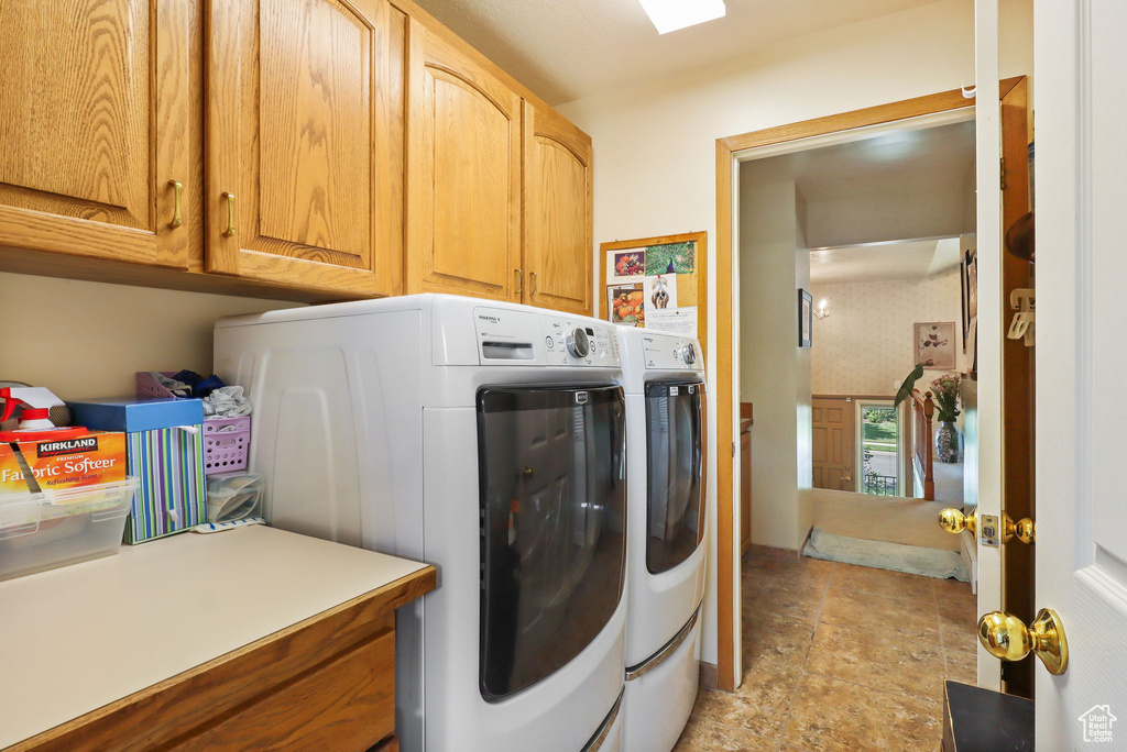 Laundry room with cabinet space and separate washer and dryer