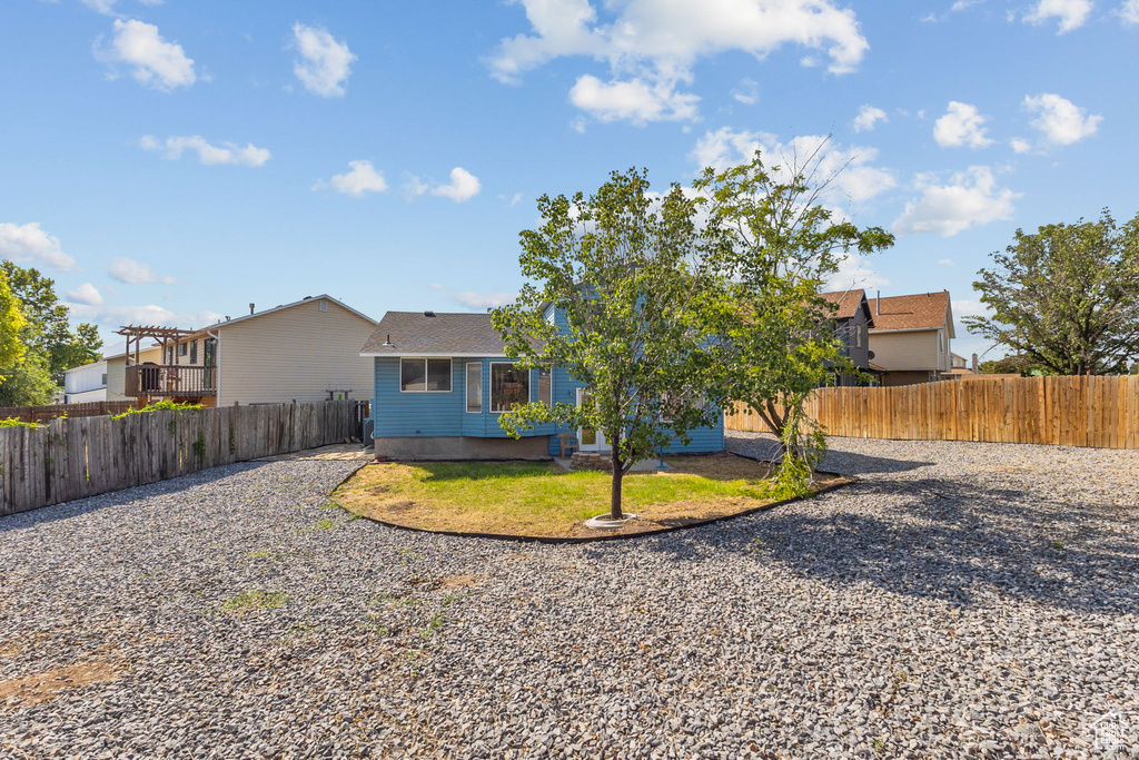 View of front of home with a fenced backyard
