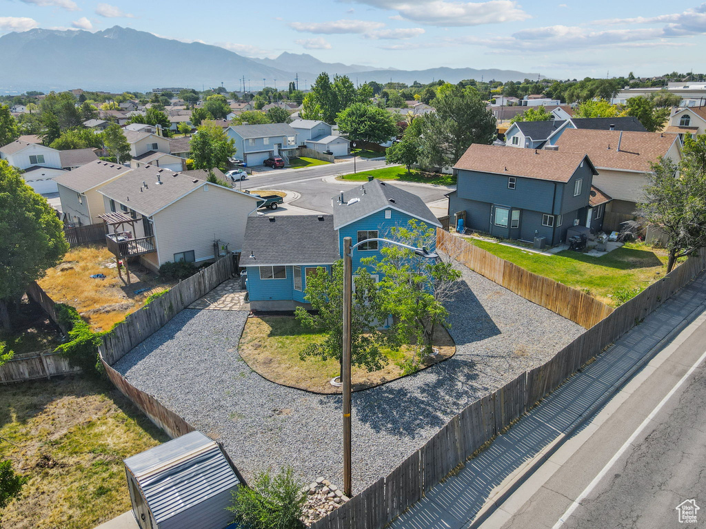Aerial perspective of suburban area with a mountainous background