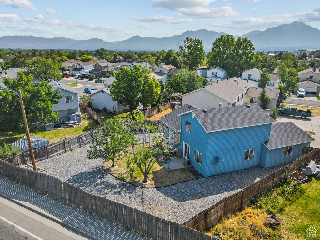 Aerial view of residential area featuring mountains