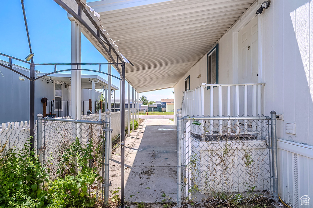 View of patio / terrace featuring a carport