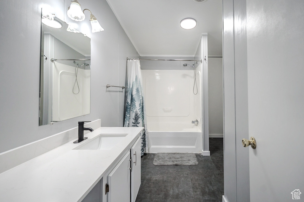 Bathroom with vanity and shower / bathtub combination with curtain