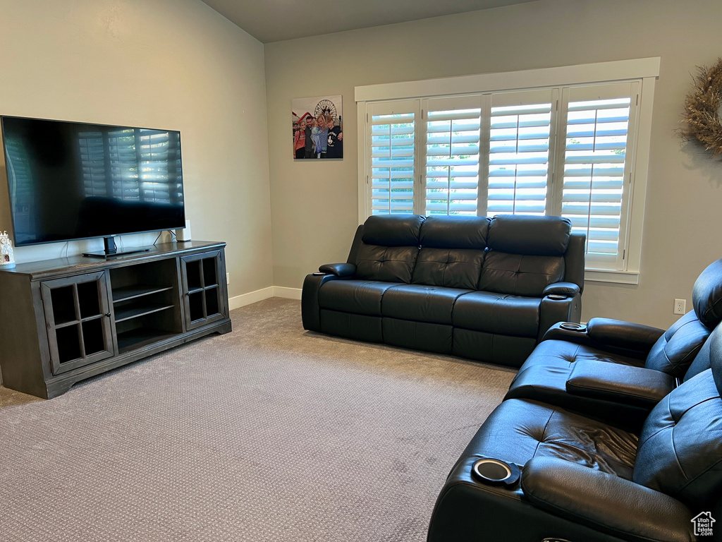 Living room featuring carpet and baseboards