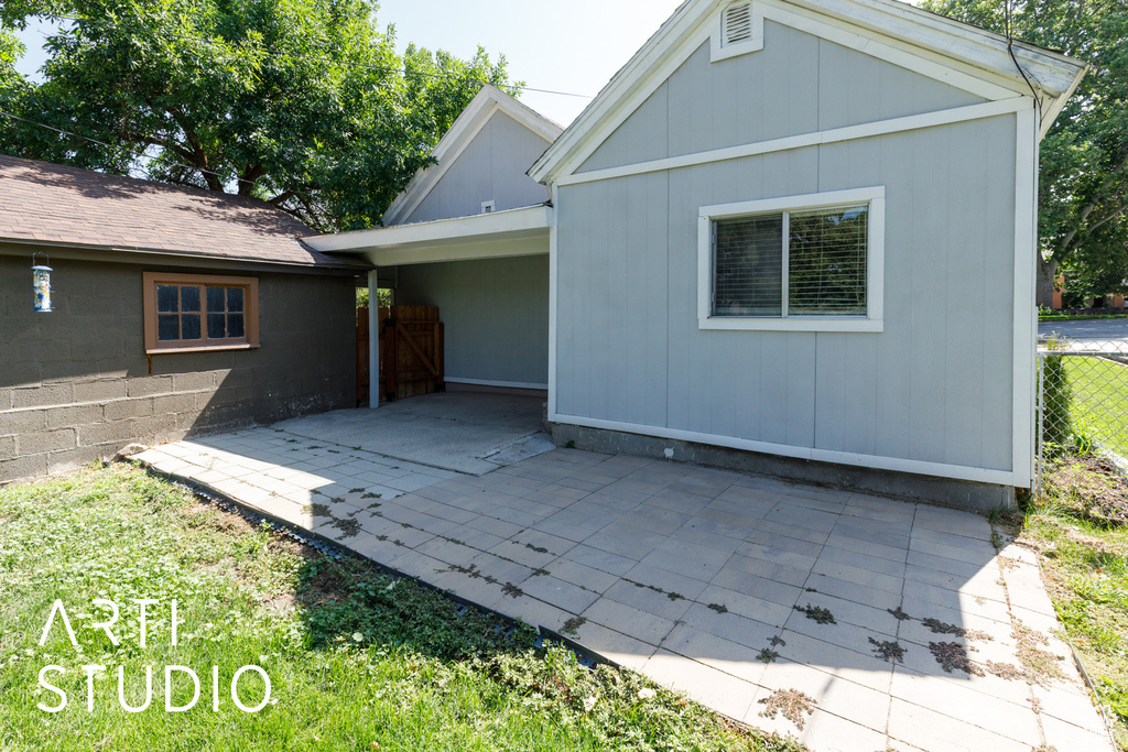 Back of house with a patio area