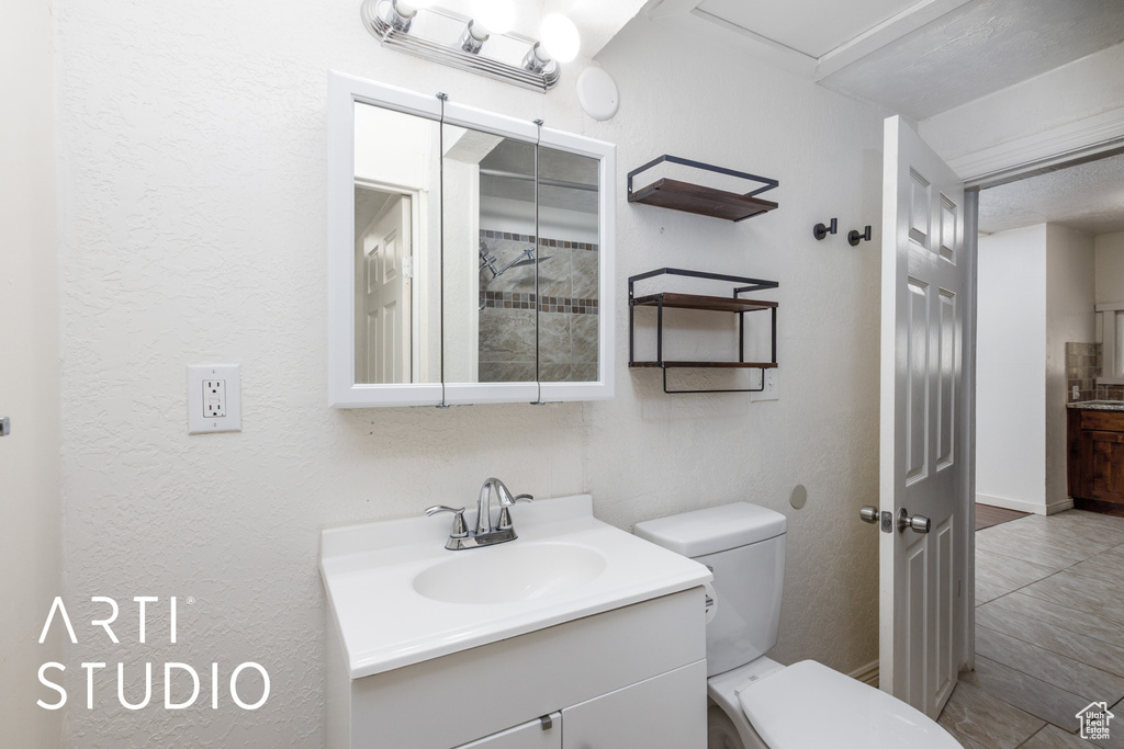 Bathroom with vanity and tile patterned flooring