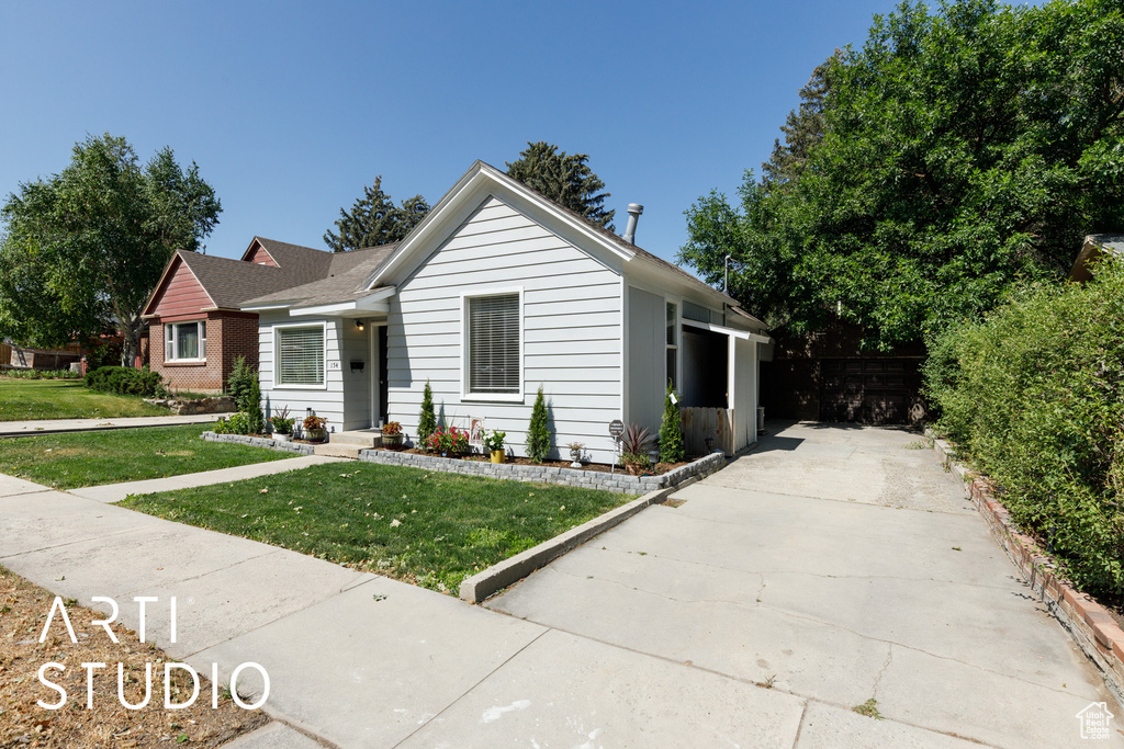 Ranch-style home with a front yard