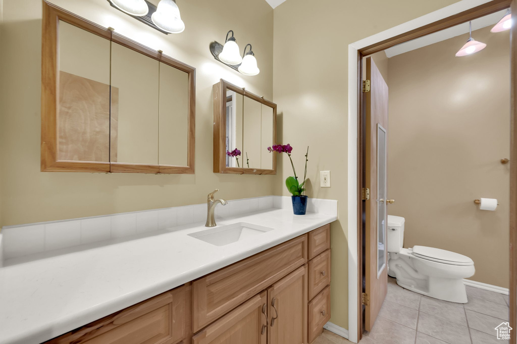 Bathroom featuring vanity and tile patterned flooring