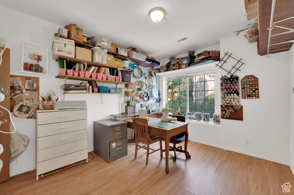 Office space featuring light wood finished floors and baseboards
