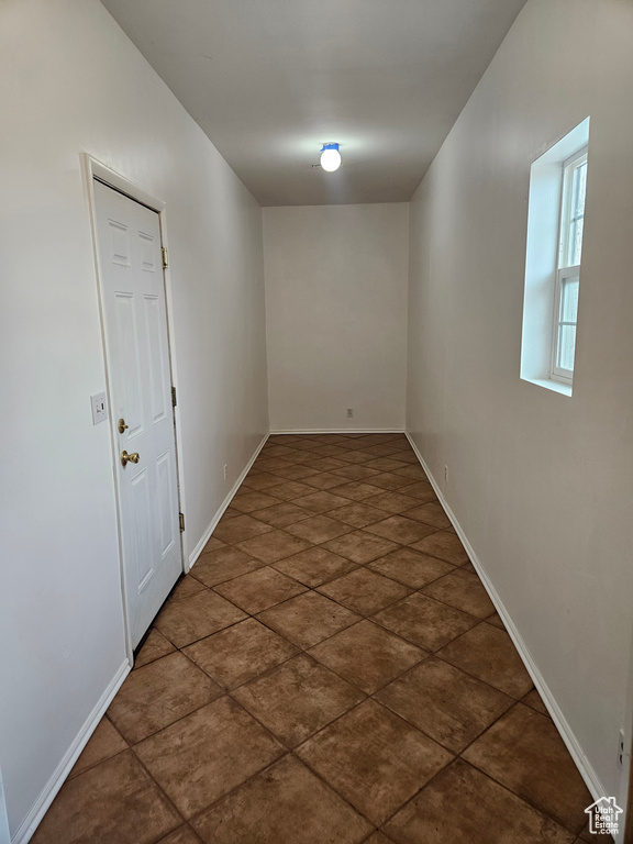 Spare room featuring baseboards