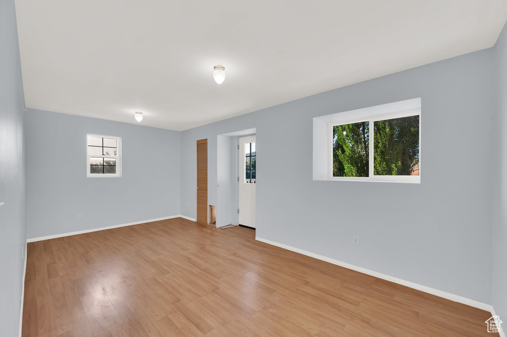 Spare room with light wood-type flooring