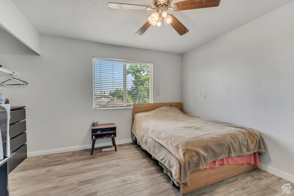 Bedroom featuring light wood-type flooring and ceiling fan