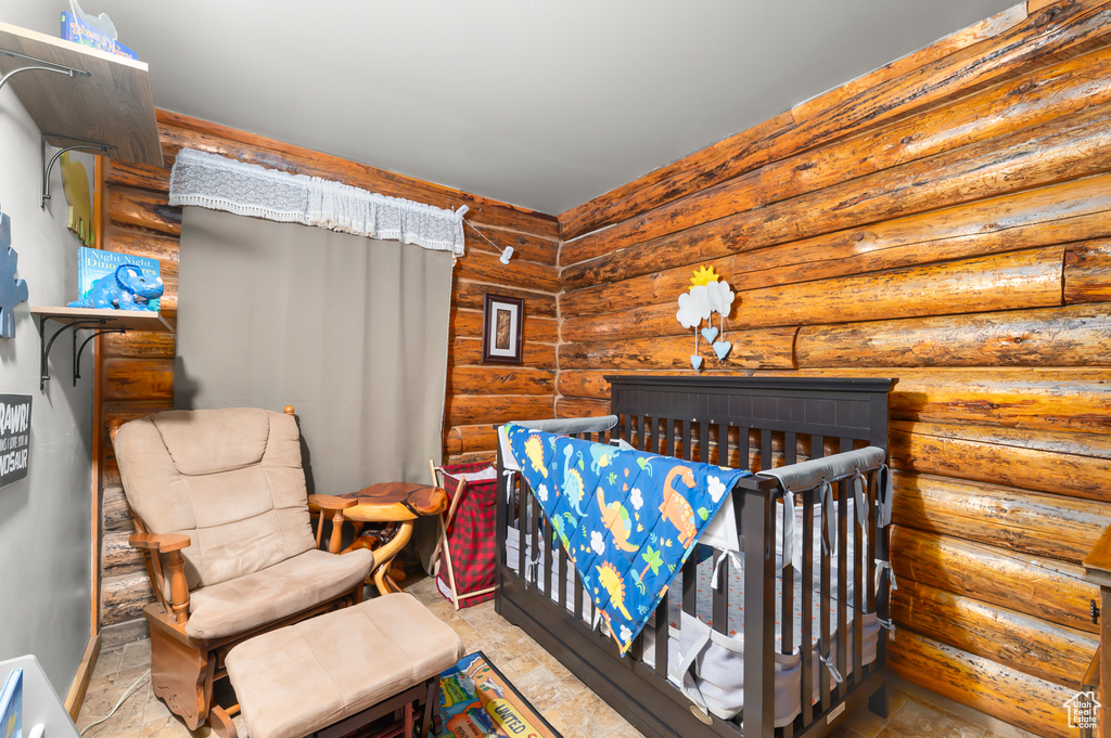 Bedroom with rustic walls