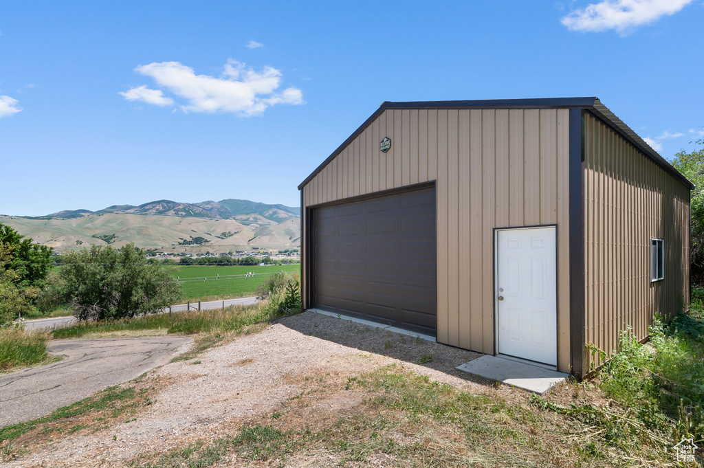 Detached garage with a mountain view