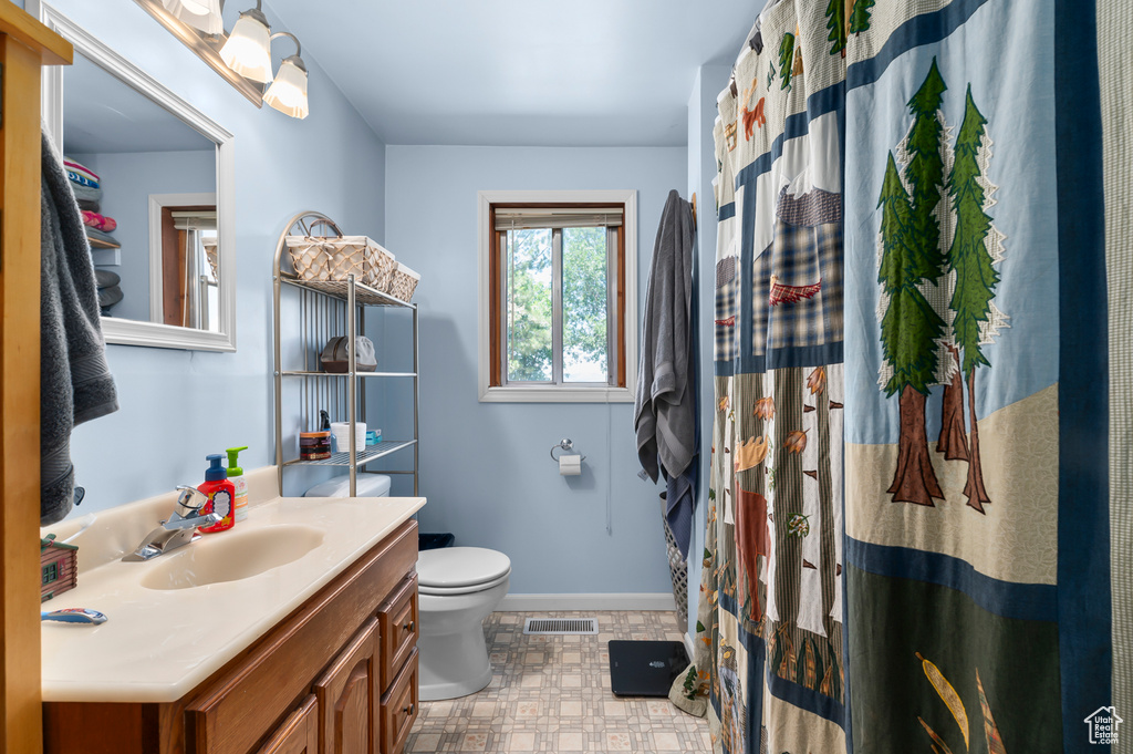 Bathroom with vanity and toilet