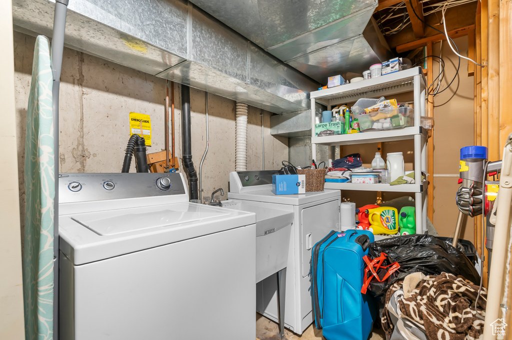 Washroom featuring washer and dryer