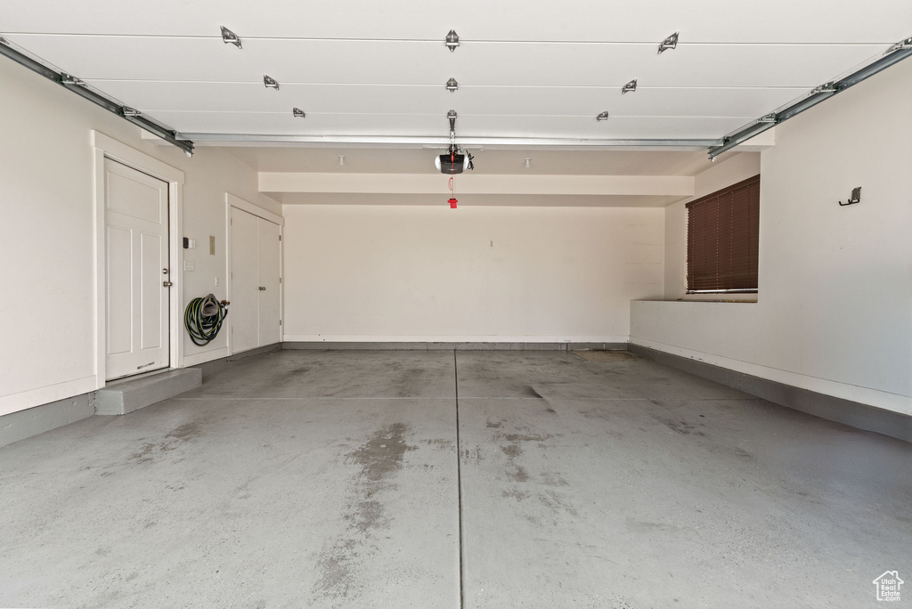 Garage featuring a garage door opener